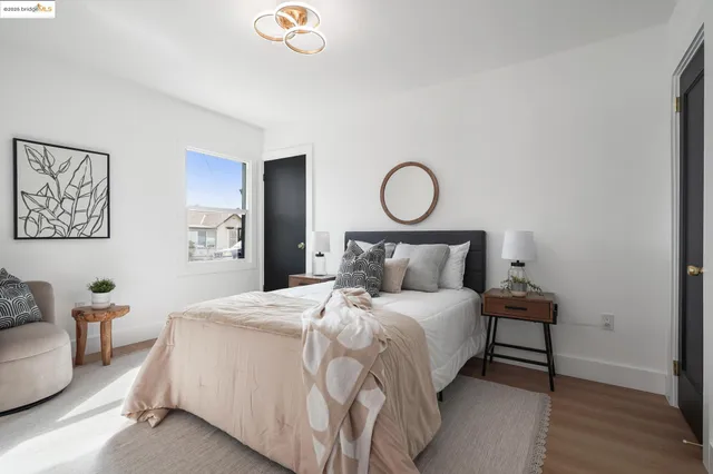 a bedroom with a bed and a couch