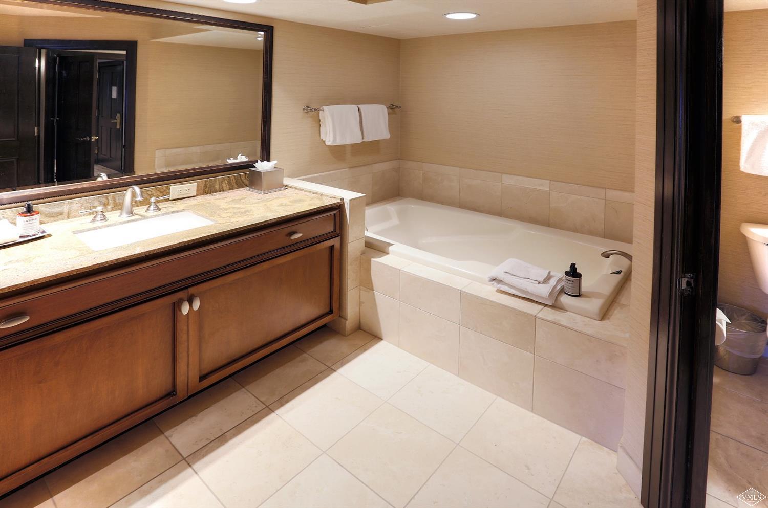 210 Offerson Road, Unit 20514 Beaver Creek, CO 81620 - Photo 9 of 16 a bathroom with a bathtub and a sink