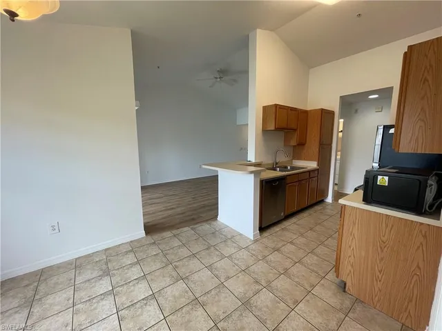 a kitchen with stainless steel appliances a refrigerator and a stove
