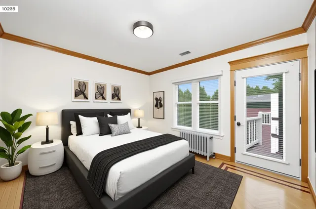 a bedroom with a bed and glass window