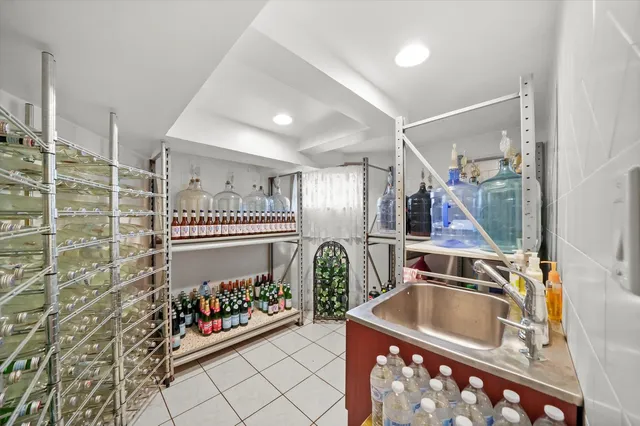 a kitchen with a sink and a stove top oven