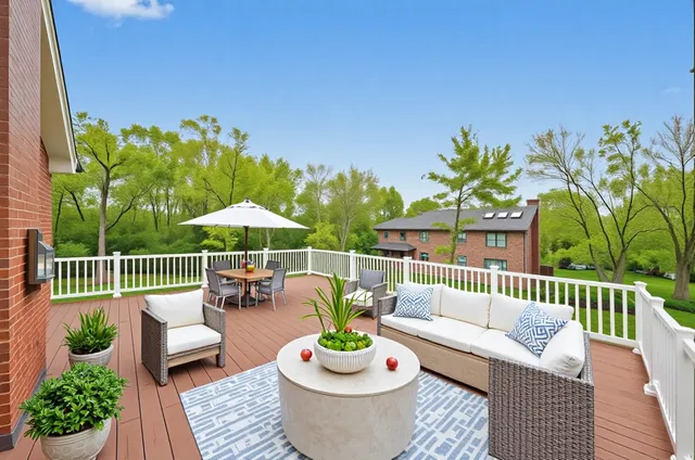 a view of a patio with couches potted plants and pool