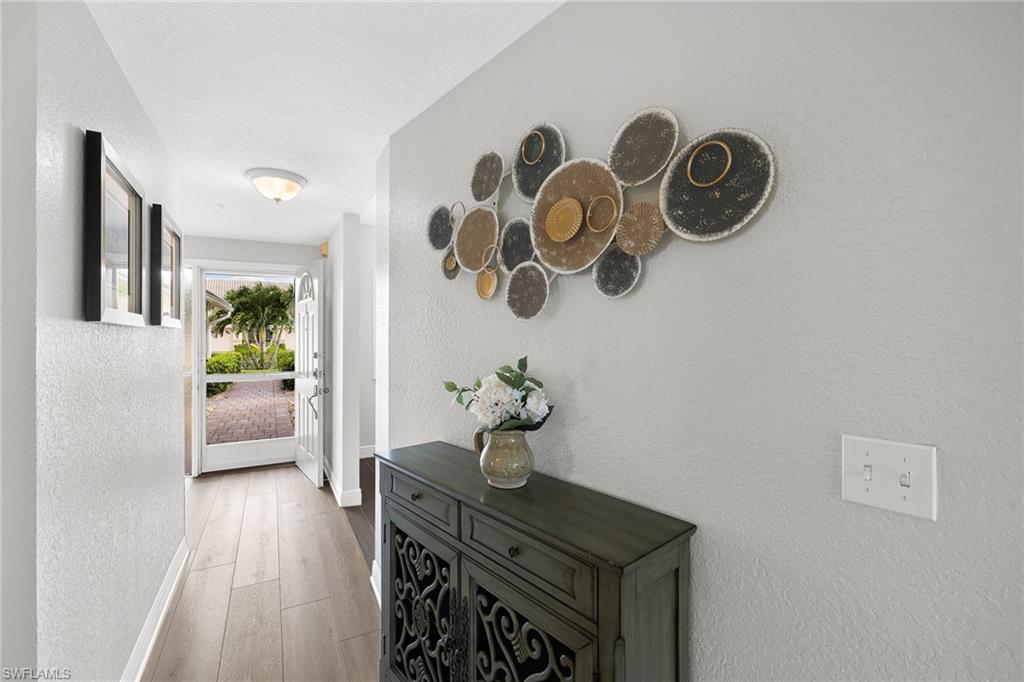 9022 Michael Circle, Unit 3 Naples, FL 34113 - Photo 15 of 25 a view of entryway with wooden floor