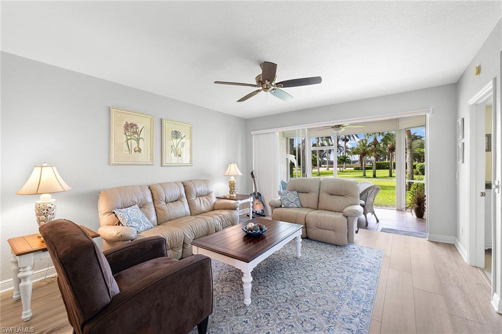 9022 Michael Circle, Unit 3 Naples, FL 34113 - Photo 5 of 25 a living room with furniture and a large window