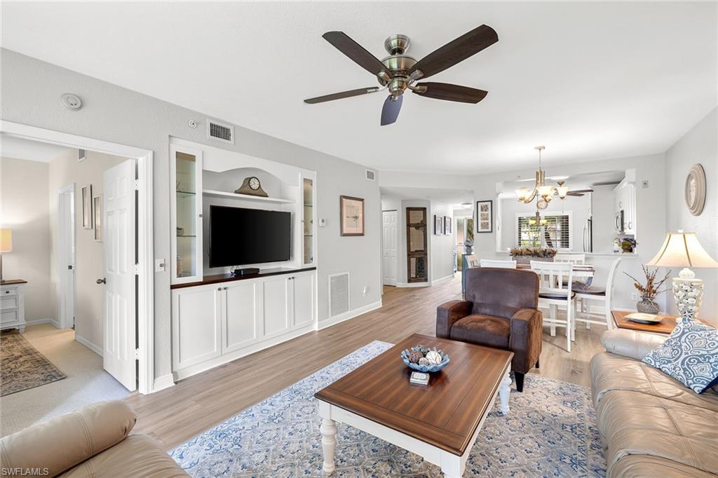 9022 Michael Circle, Unit 3 Naples, FL 34113 - Photo 7 of 25 a living room with furniture and a flat screen tv