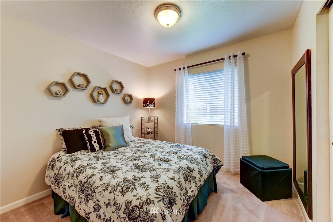 110 219th Place Southeast Bothell, WA 98021 - Photo 22 of 27 a bedroom with a bed and a window