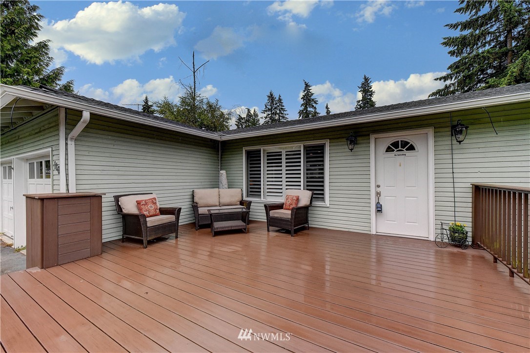 110 219th Place Southeast Bothell, WA 98021 - Photo 4 of 27 a backyard of a house with table and chairs