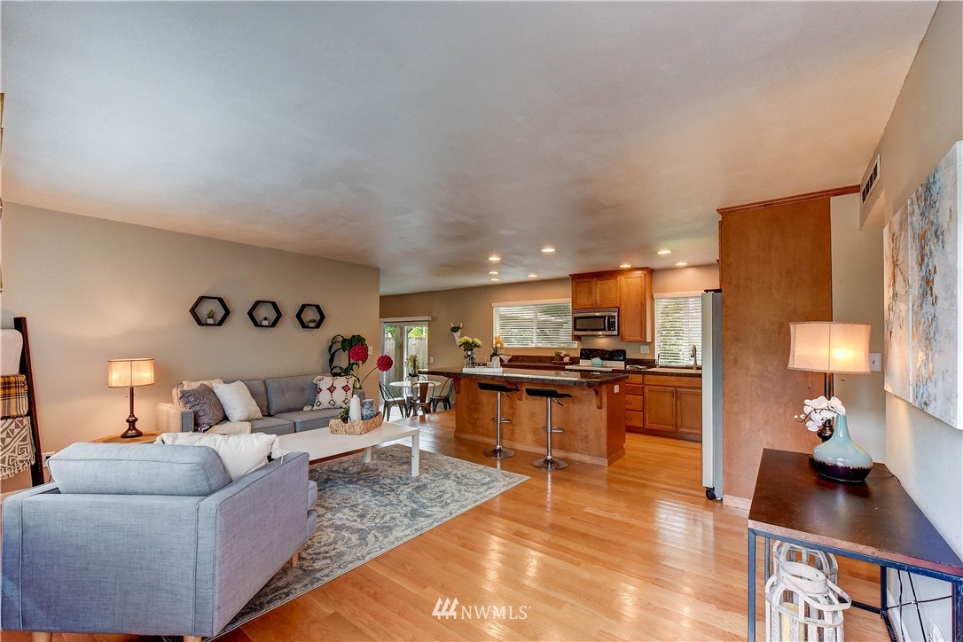 110 219th Place Southeast Bothell, WA 98021 - Photo 5 of 27 a living room with furniture and a wooden floor