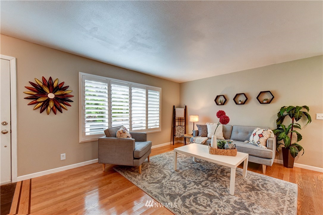 110 219th Place Southeast Bothell, WA 98021 - Photo 6 of 27 a living room with furniture and a large window