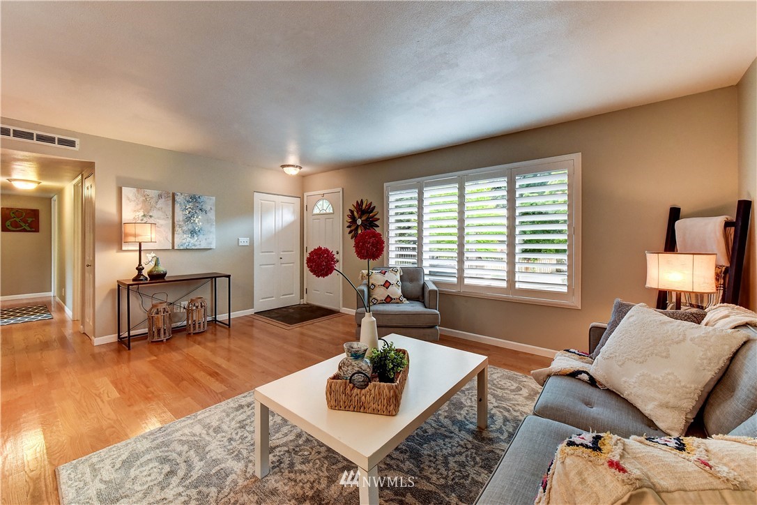 110 219th Place Southeast Bothell, WA 98021 - Photo 7 of 27 a living room with furniture and a large window