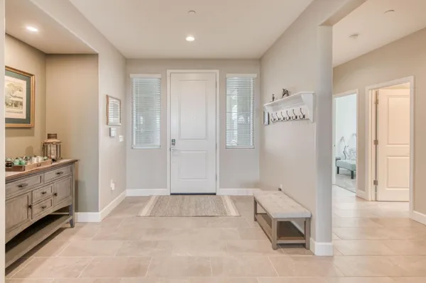 a spacious bathroom with a granite countertop sink a mirror and a shower
