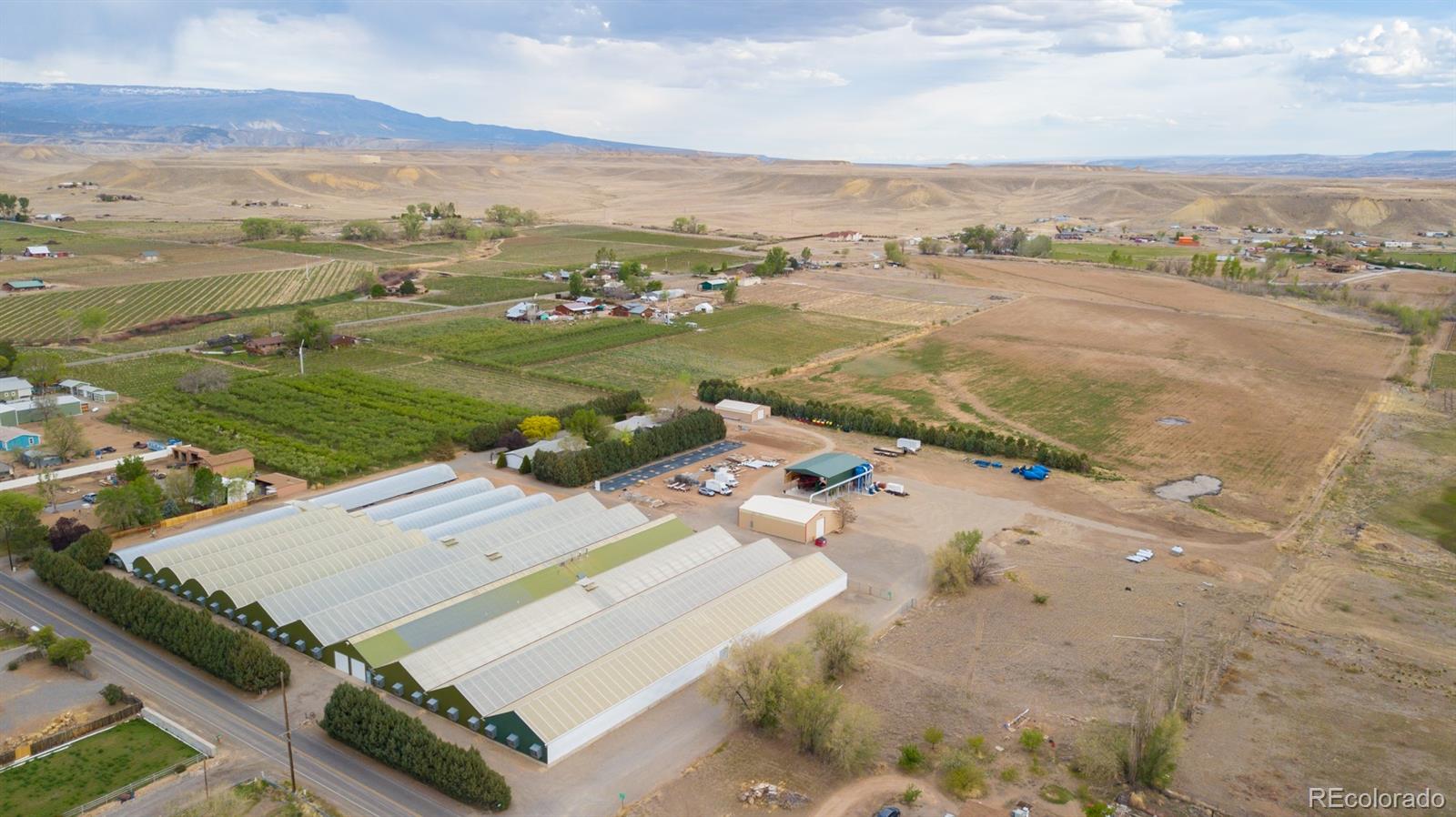 3281 C Road Palisade, CO 81526 - Photo 31 of 33 an aerial view of a residential houses with outdoor space and river