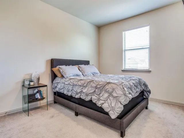 a view of walk in closet with clothes