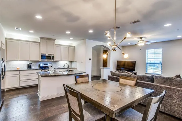 a kitchen with sink microwave and stove