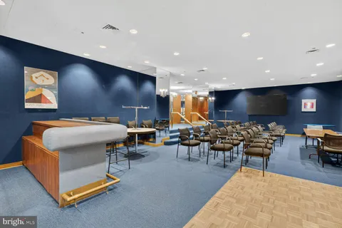 a group of people sitting at tables in a room