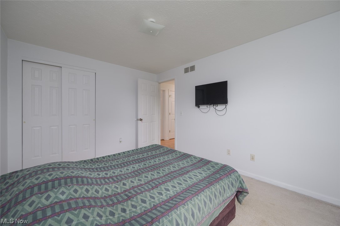 8045 State Rte 5 Ravenna, OH 44266 - Photo 27 of 32 Bedroom with light carpet