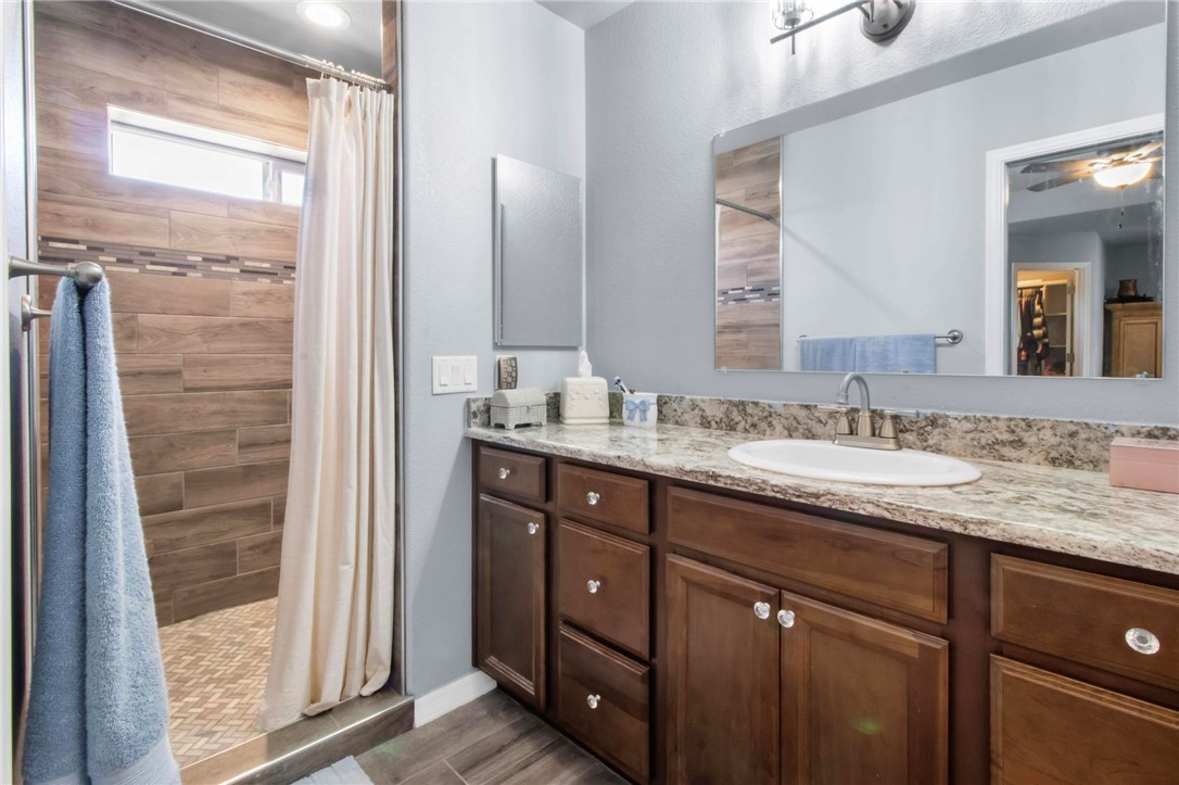 3897 Easy Street Kingman, AZ 86409 - Photo 22 of 53 a bathroom with a granite countertop sink and a mirror