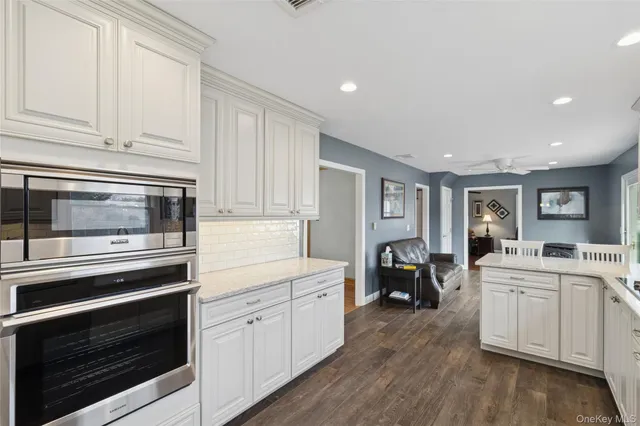 a kitchen with a stove oven and sink