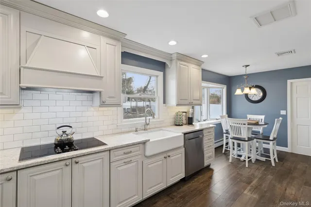 a kitchen with sink cabinets and window