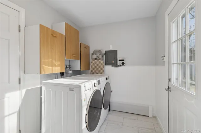 a utility room with dryer and washer