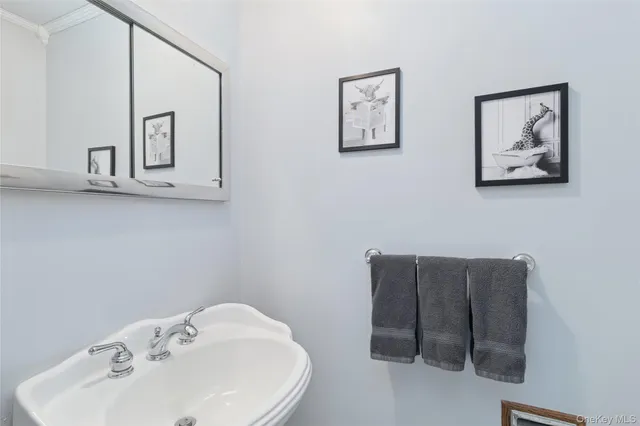 a bathroom with a sink and mirror
