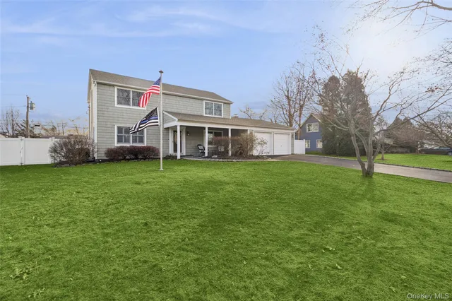 a front view of house with yard and green space
