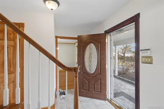 a front view of a house with wooden floor and windows
