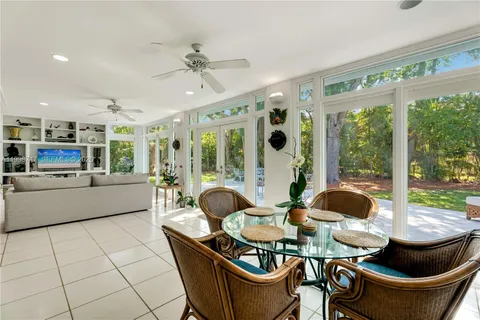 a view of a table and chairs in the garden