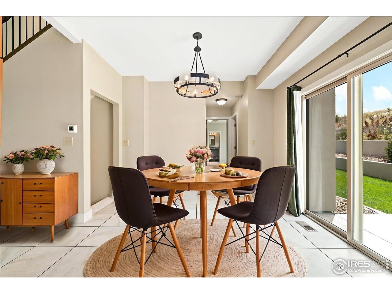 403 Double Tree Drive Greeley, CO 80634 - Photo 13 of 49 a view of a dining room with furniture window and wooden floor