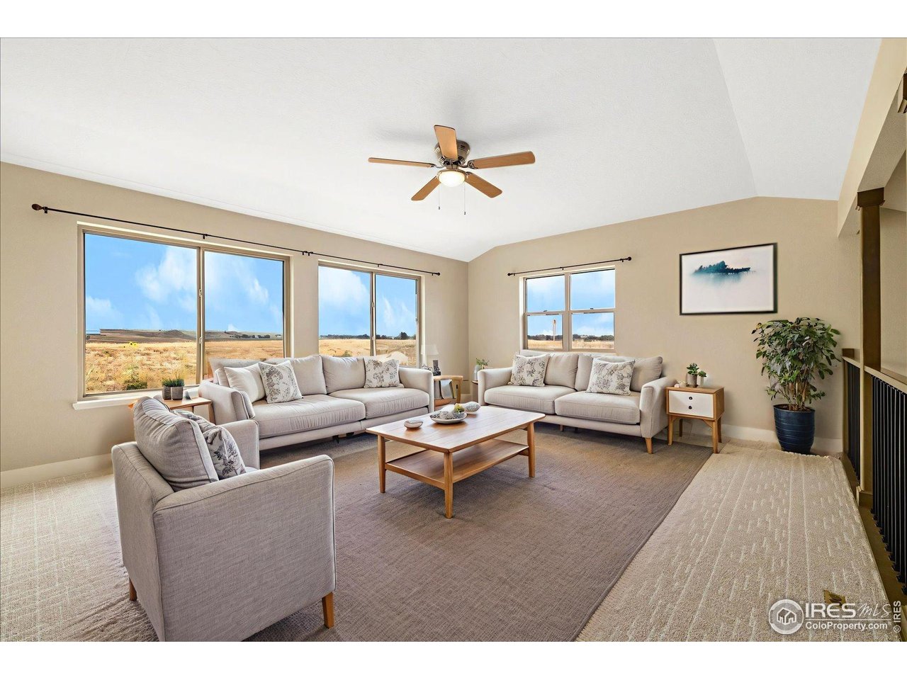 403 Double Tree Drive Greeley, CO 80634 - Photo 23 of 49 a living room with furniture or couch and a large window