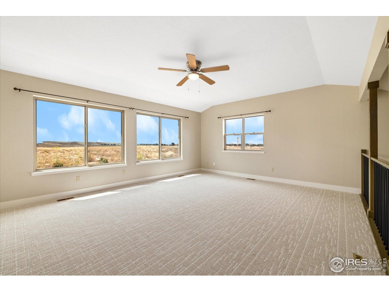 403 Double Tree Drive Greeley, CO 80634 - Photo 24 of 49 a view of a livingroom with a ceiling fan and window