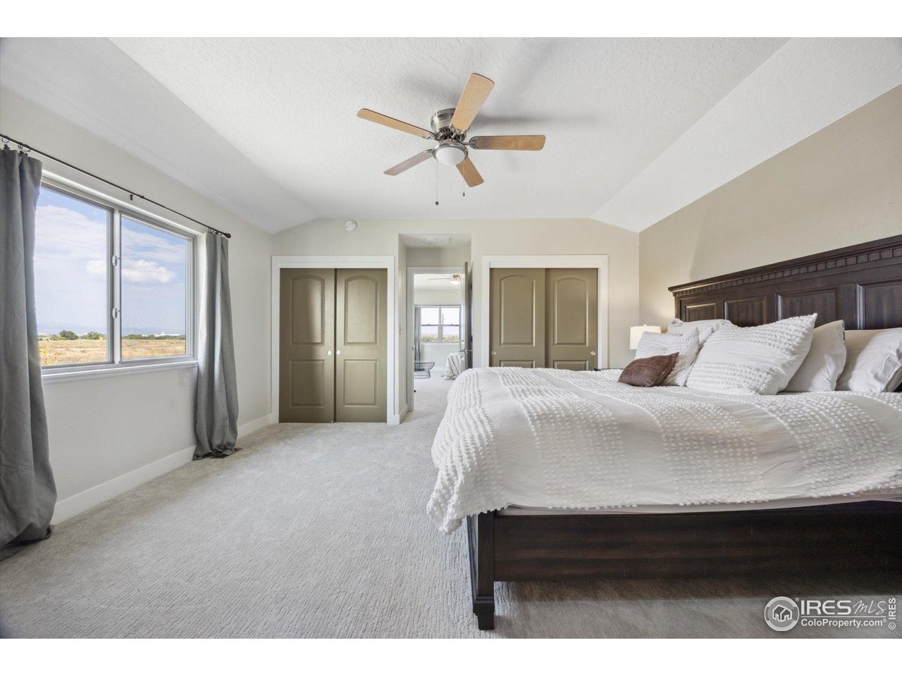 403 Double Tree Drive Greeley, CO 80634 - Photo 25 of 49 a bedroom with a bed and a window