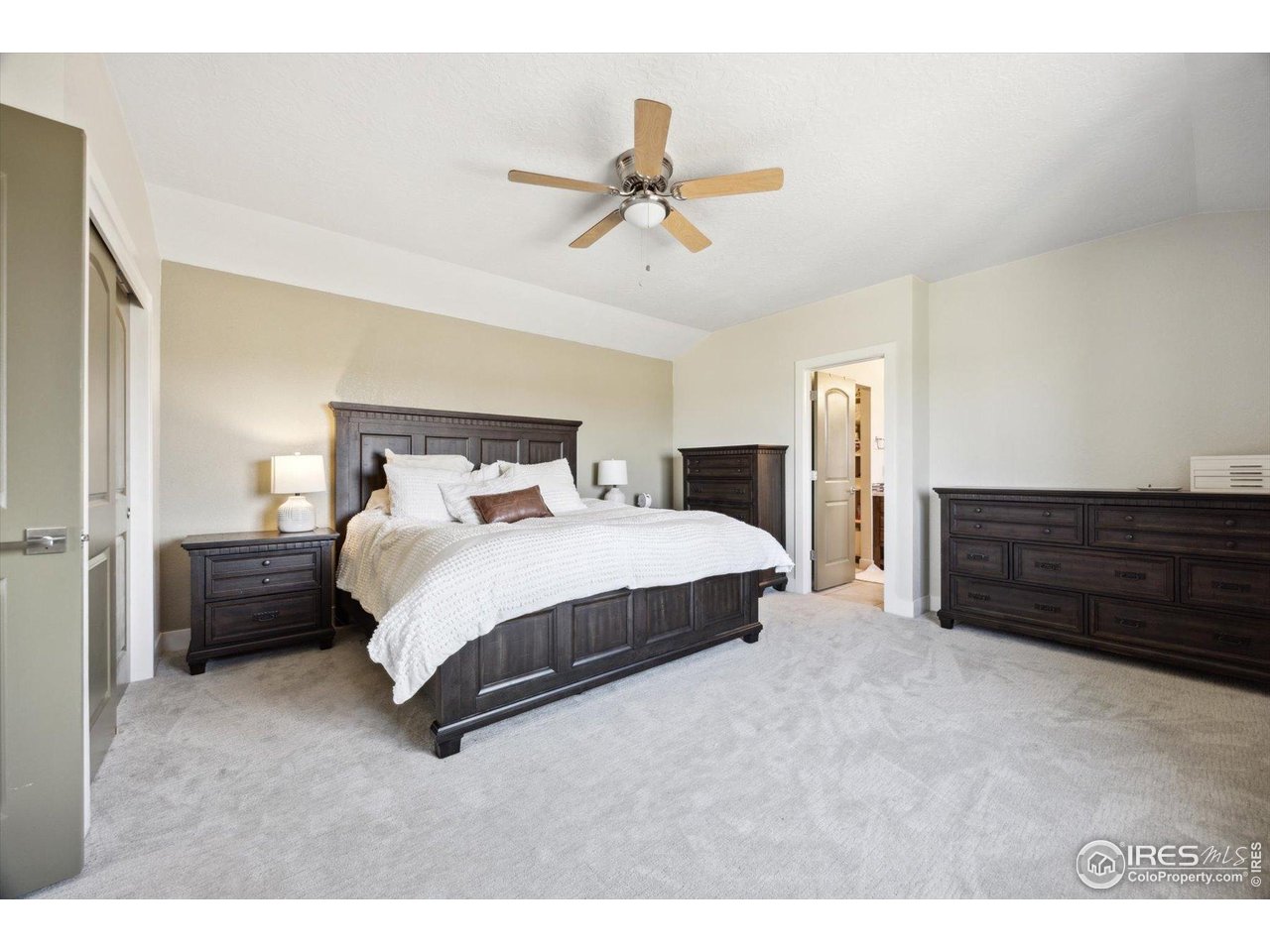 403 Double Tree Drive Greeley, CO 80634 - Photo 26 of 49 a bedroom with a bed and closet