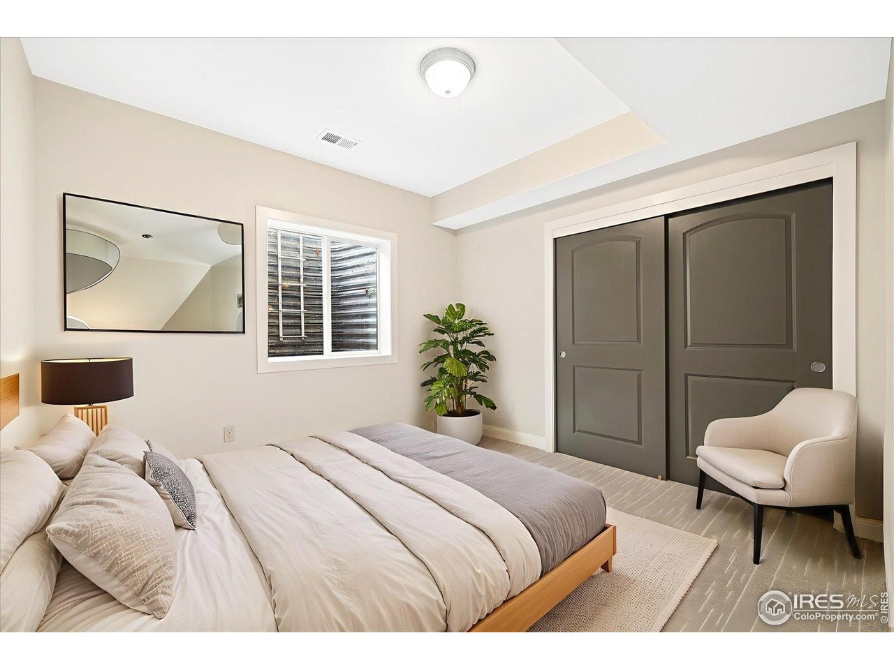 403 Double Tree Drive Greeley, CO 80634 - Photo 33 of 49 a bedroom with a bed and a couch