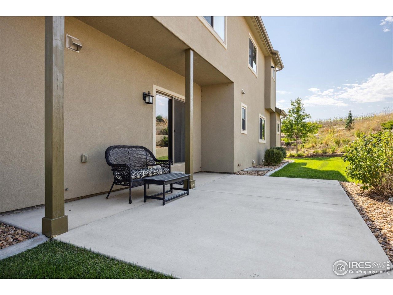 403 Double Tree Drive Greeley, CO 80634 - Photo 38 of 49 a swimming pool with outdoor seating and a potted plant
