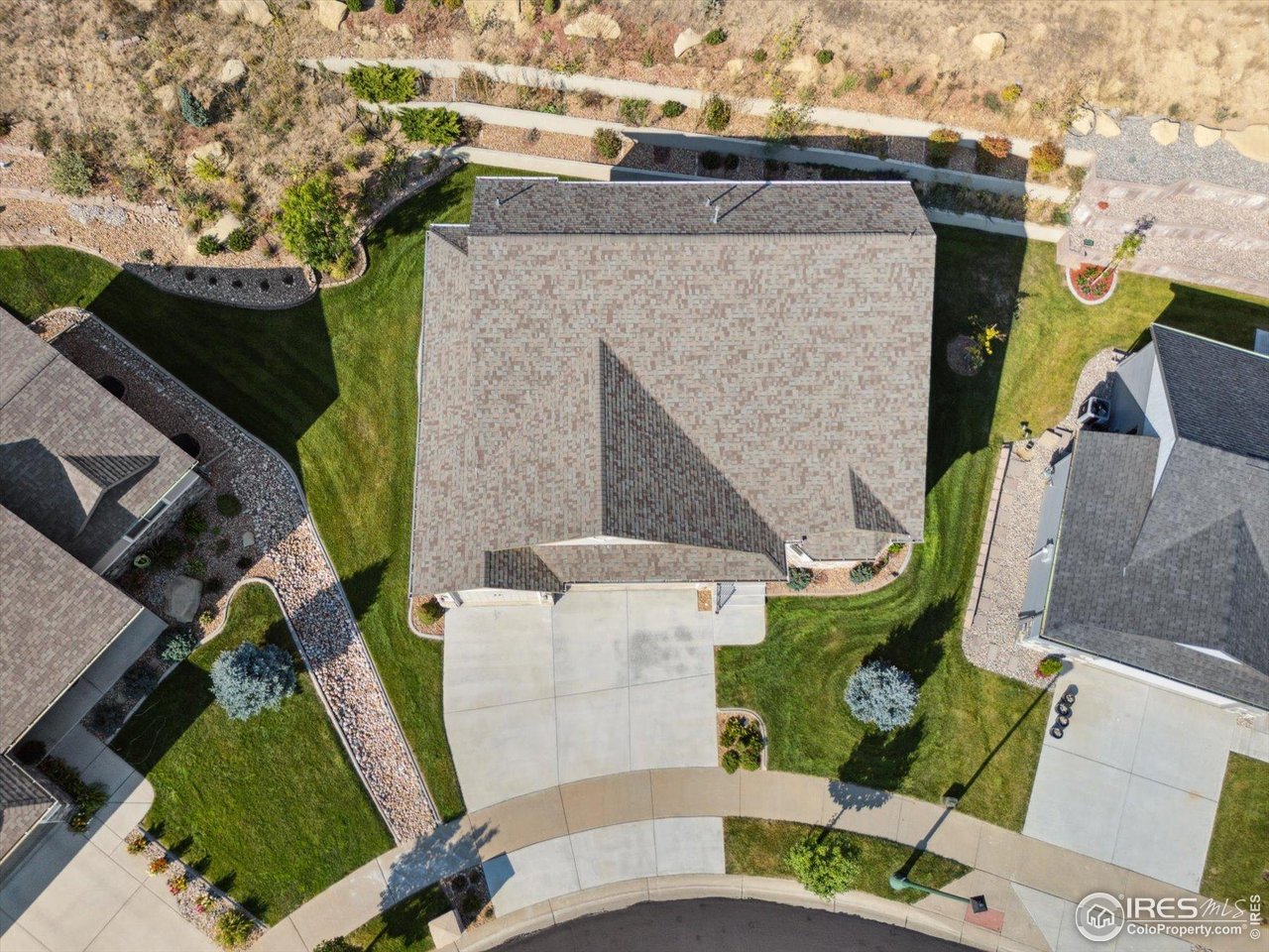 403 Double Tree Drive Greeley, CO 80634 - Photo 43 of 49 an aerial view of a house with a yard and potted plants