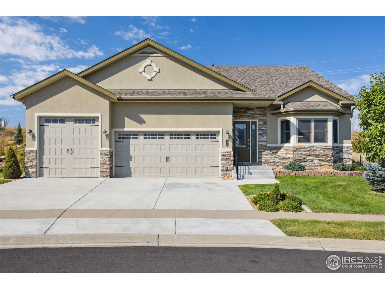 403 Double Tree Drive Greeley, CO 80634 - Photo 49 of 49 a front view of a house with a yard and garage