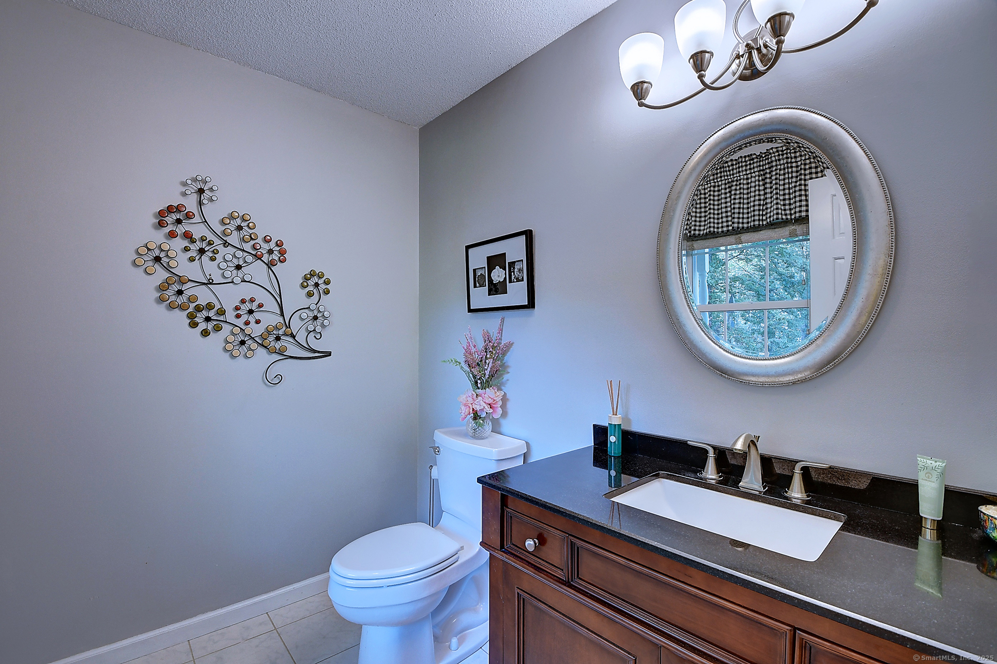 884 Moss Farms Road Cheshire, CT 06410 - Photo 18 of 39 a bathroom with a toilet a sink and a mirror
