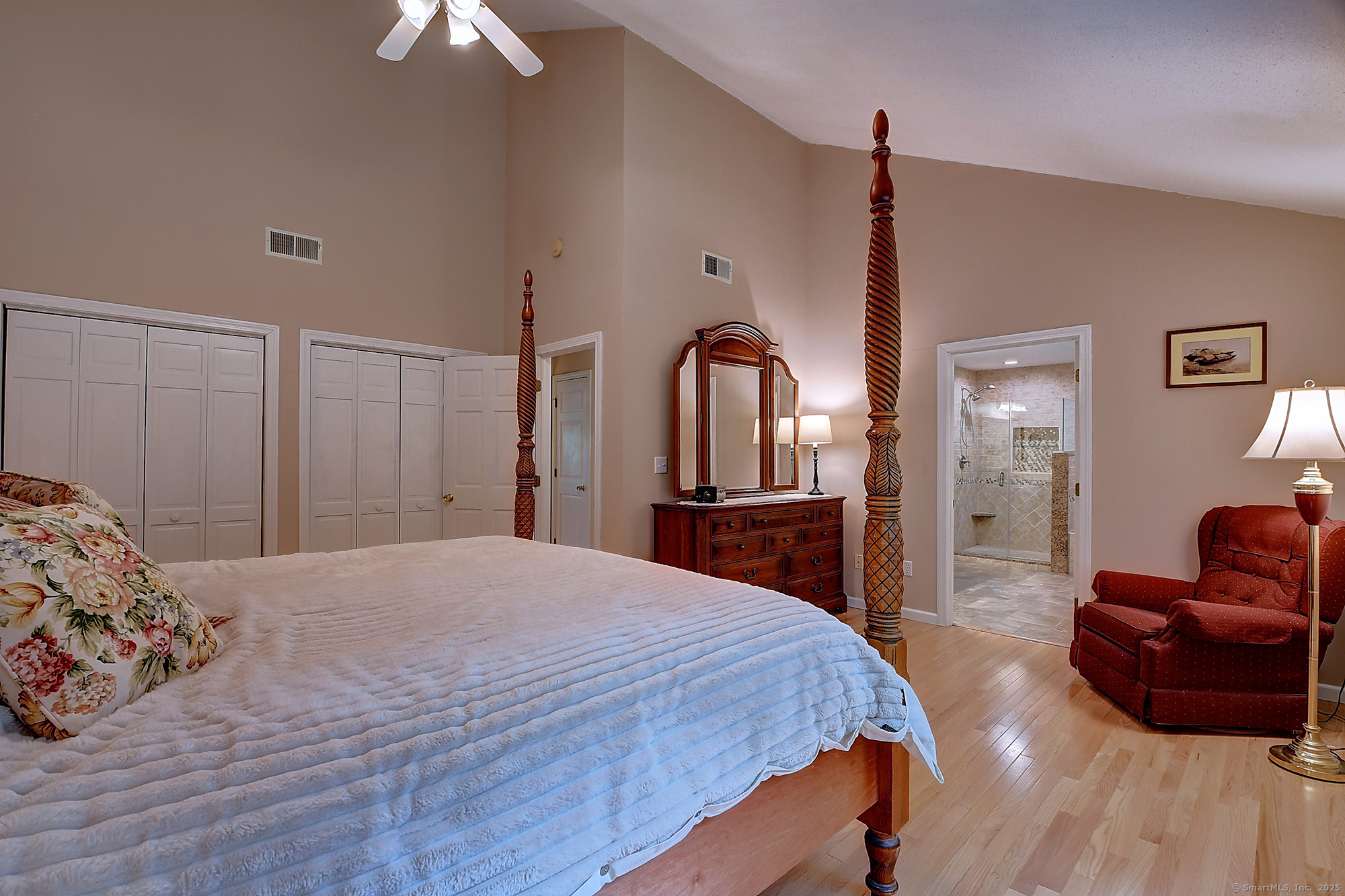 884 Moss Farms Road Cheshire, CT 06410 - Photo 23 of 39 a spacious bedroom with a bed a couch and dresser