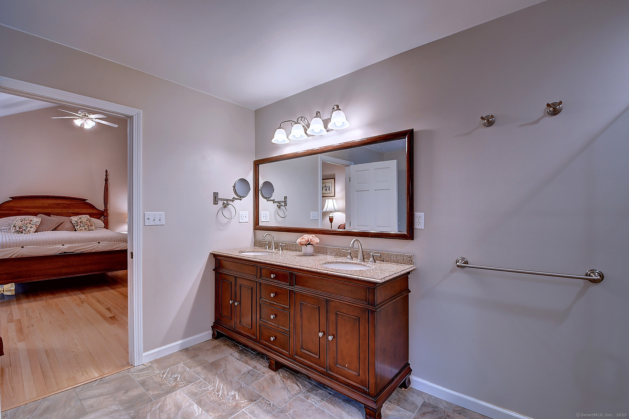 884 Moss Farms Road Cheshire, CT 06410 - Photo 25 of 39 a en suite bathroom with a toilet sink and mirror