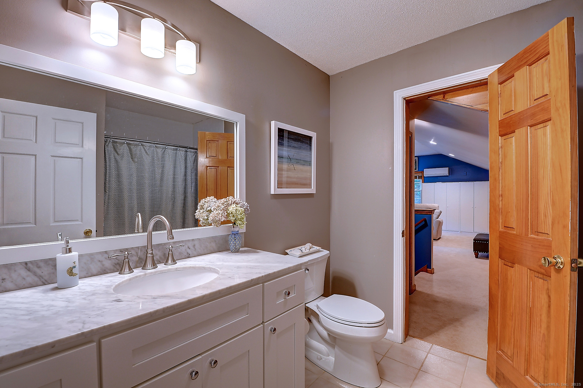 884 Moss Farms Road Cheshire, CT 06410 - Photo 31 of 39 a bathroom with a granite countertop toilet sink and mirror