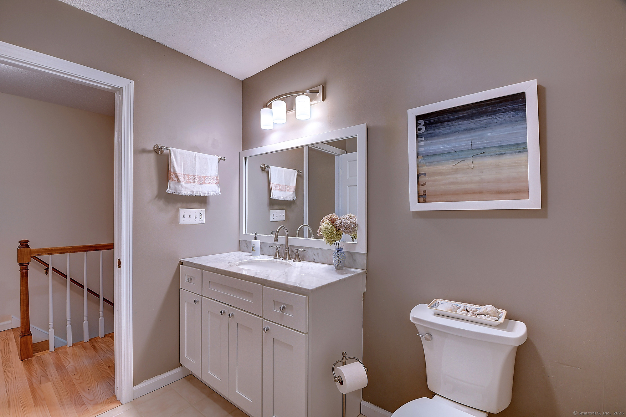 884 Moss Farms Road Cheshire, CT 06410 - Photo 32 of 39 a bathroom with a toilet sink and mirror