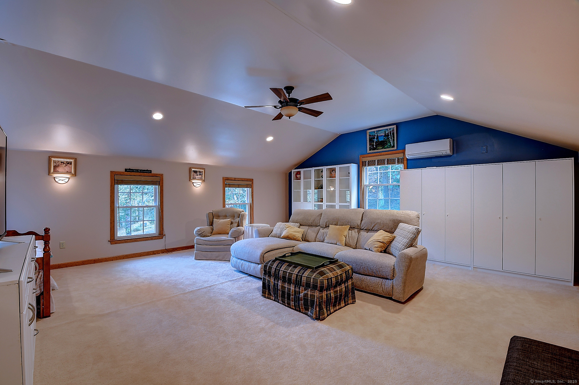 884 Moss Farms Road Cheshire, CT 06410 - Photo 33 of 39 a living room with furniture ceiling fan and a window