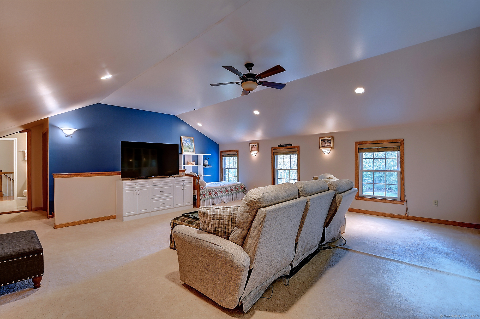 884 Moss Farms Road Cheshire, CT 06410 - Photo 34 of 39 a living room with furniture and a flat screen tv