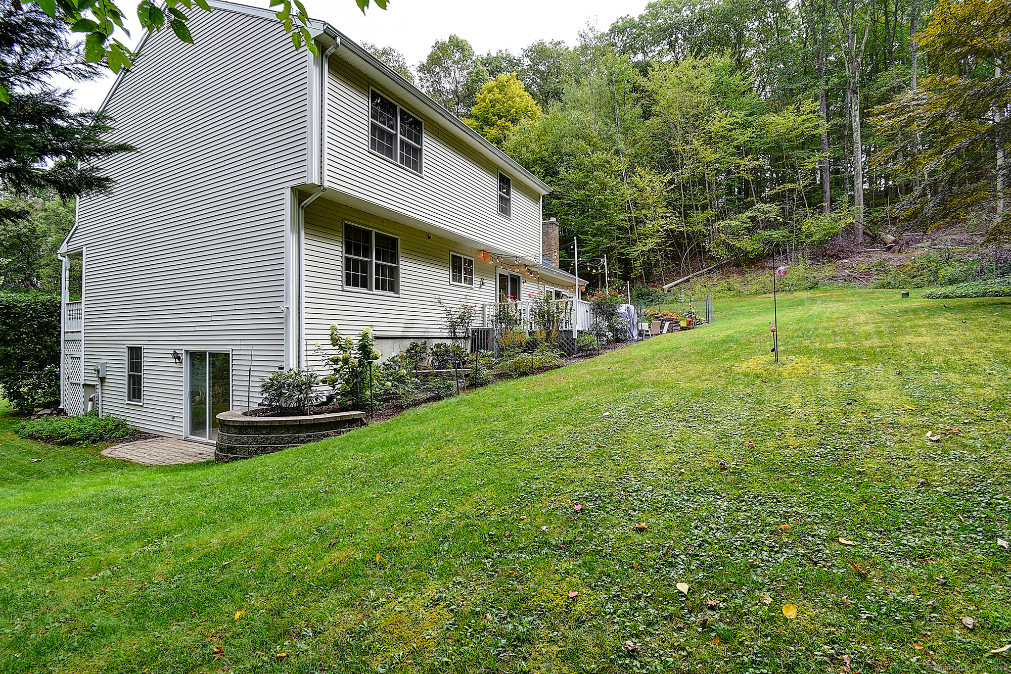 884 Moss Farms Road Cheshire, CT 06410 - Photo 35 of 39 a view of a house with a yard and sitting area