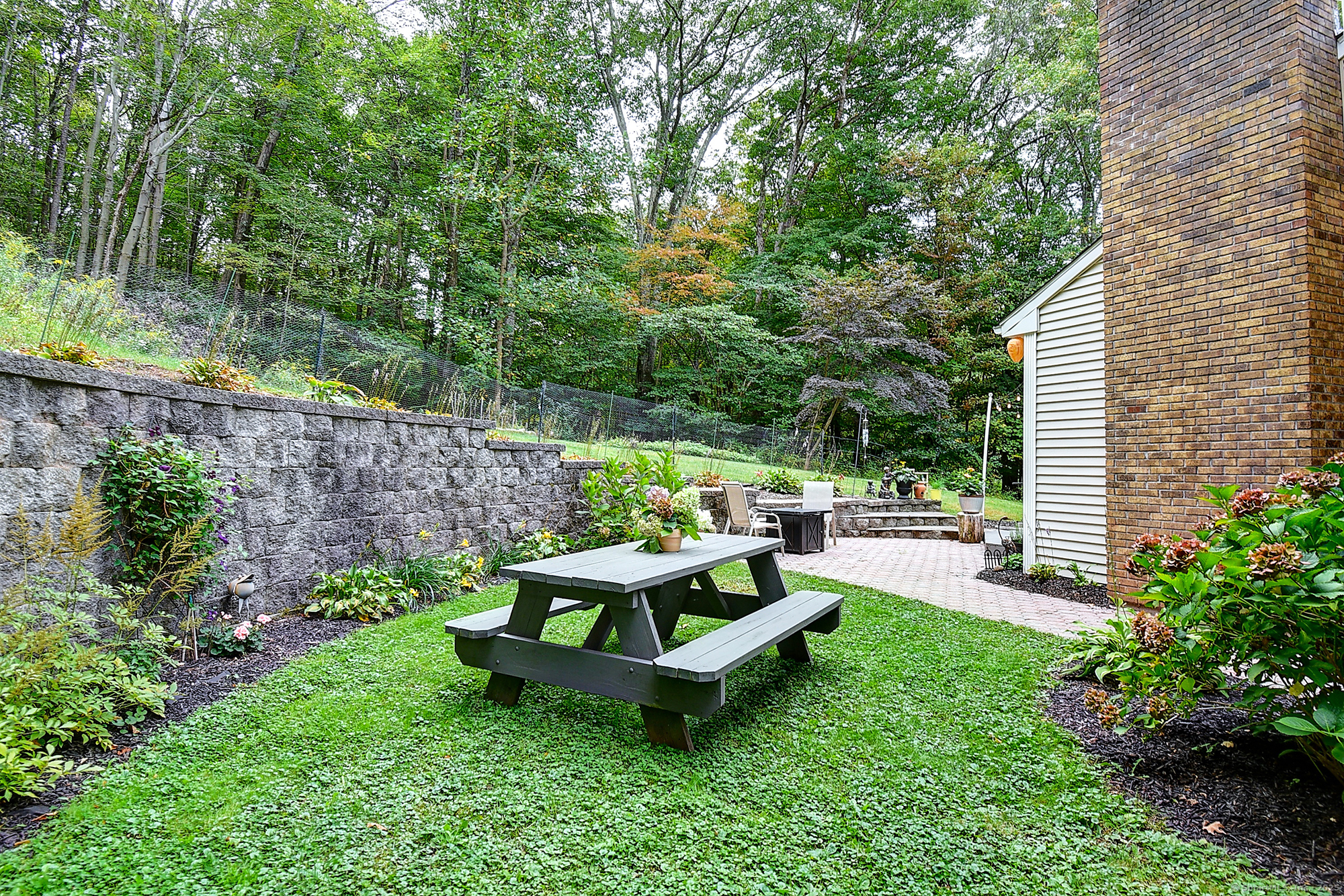 884 Moss Farms Road Cheshire, CT 06410 - Photo 38 of 39 a wooden bench sitting in the garden
