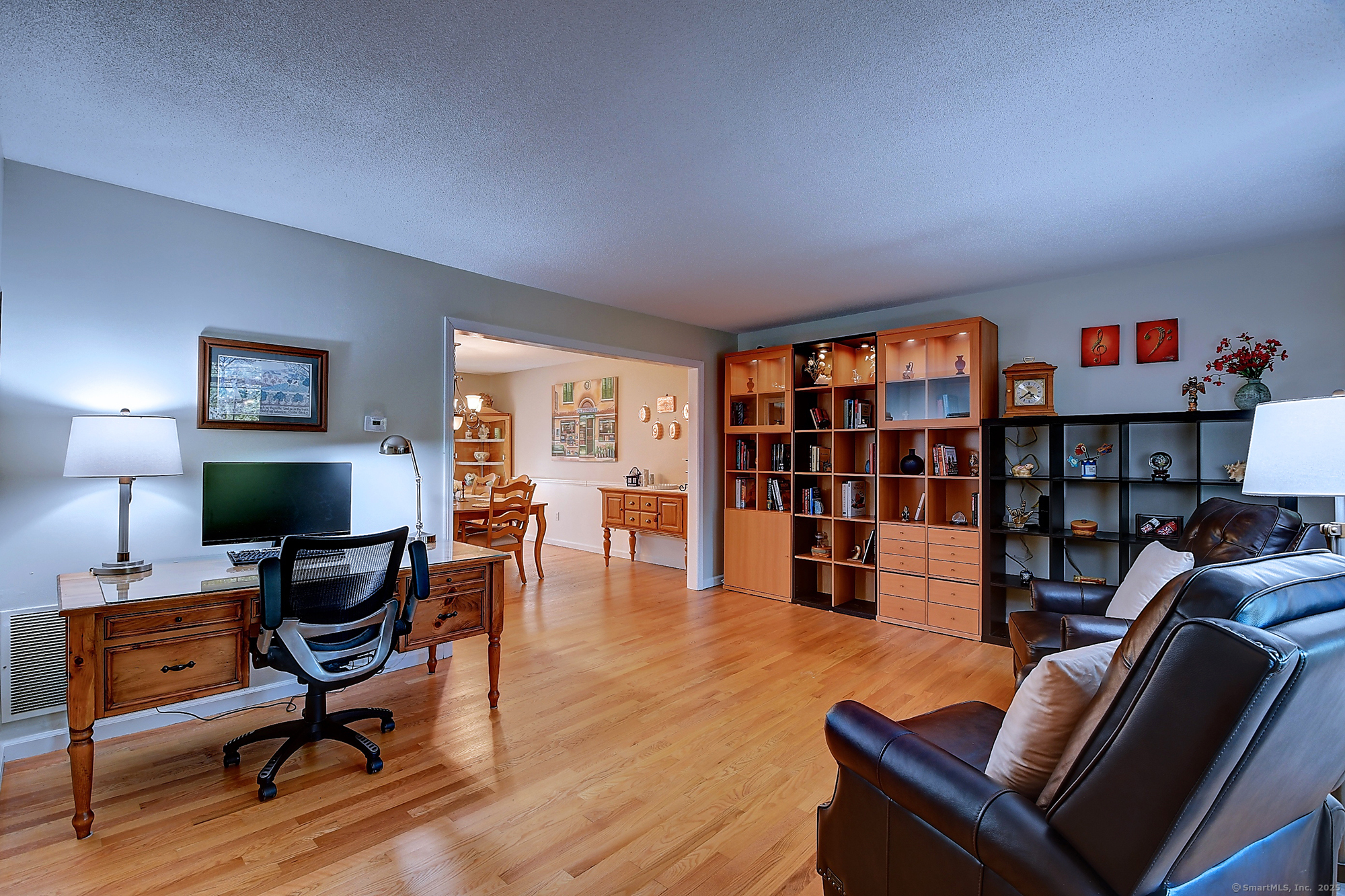 884 Moss Farms Road Cheshire, CT 06410 - Photo 4 of 39 a view of a livingroom with workspace and a couch