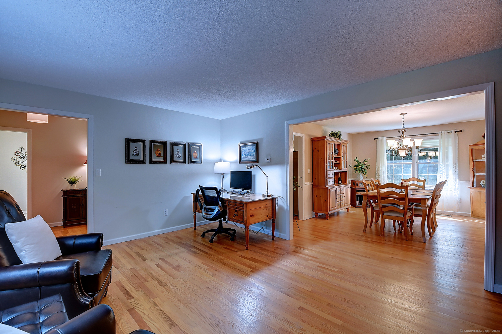 884 Moss Farms Road Cheshire, CT 06410 - Photo 5 of 39 a dining room with furniture and wooden floor