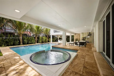 a view of swimming pool with chairs