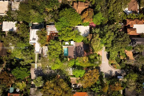 an aerial view of houses with yard